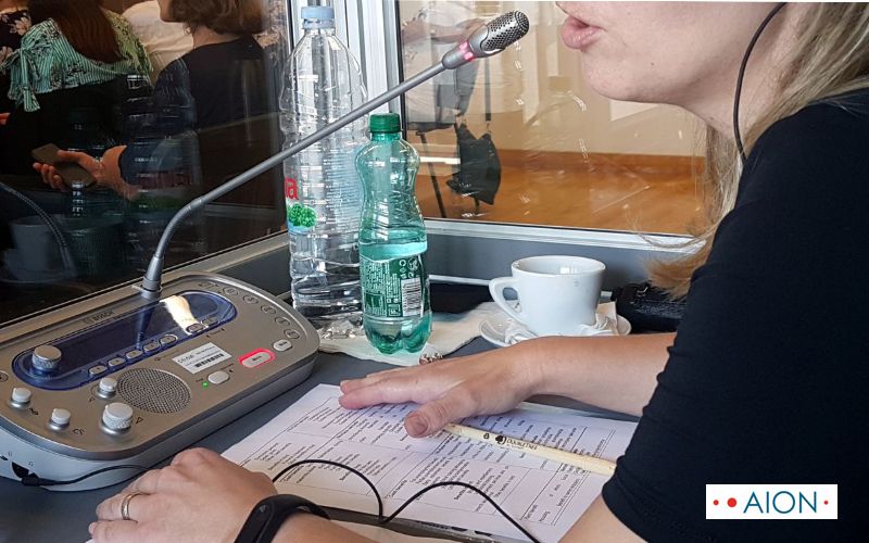 Interpreter's glossary and notes on the interpreting booth's desk during conference