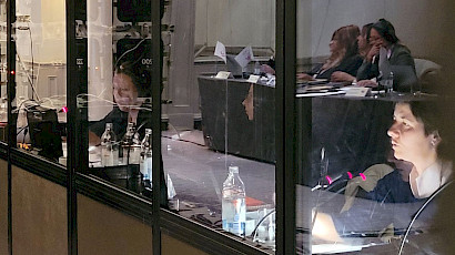 Two adjacent interpreter booths at a conference