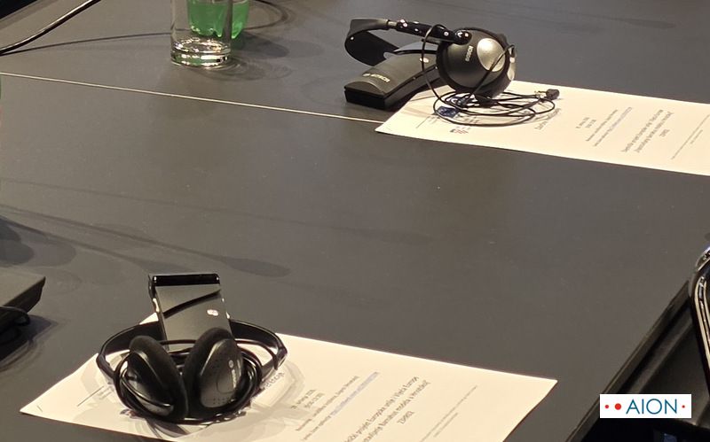 interpretation headsets and receivers on a conference table at a Zagreb conference